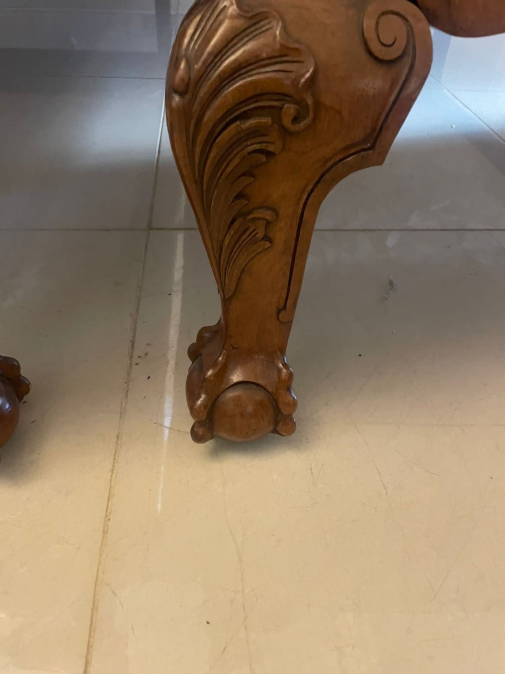 A pair of antique burr walnut single beds featuring high arched headboards, carved shell detailing on the aprons, and scroll-topped footposts. View X