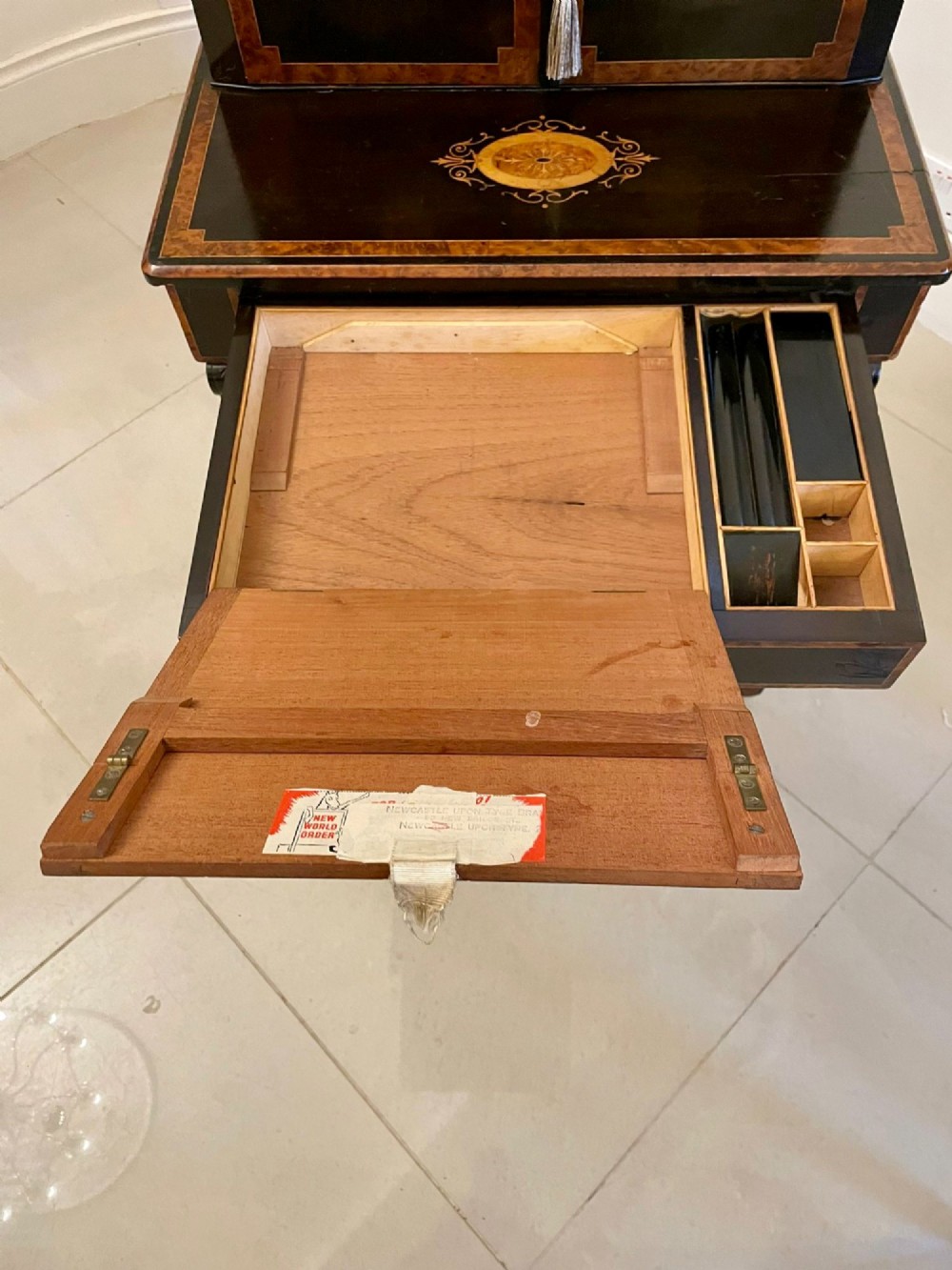 A Victorian ebonised writing desk featuring burr walnut inlaid panels, central oval marquetry medallions, and a pierced brass gallery along the top. View VII