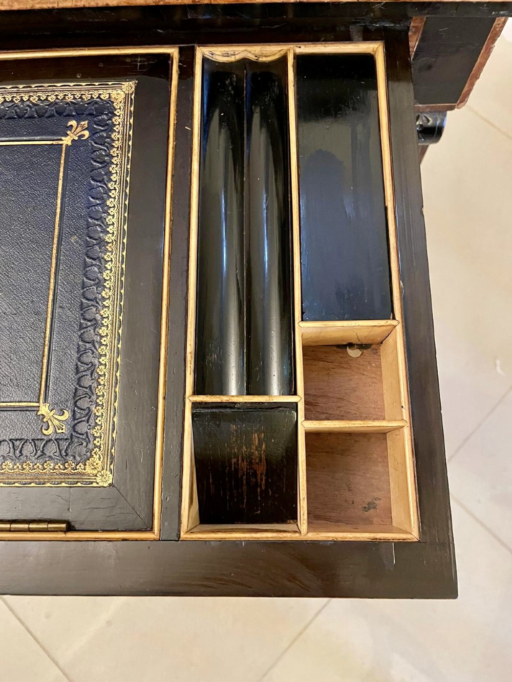 A Victorian ebonised writing desk featuring burr walnut inlaid panels, central oval marquetry medallions, and a pierced brass gallery along the top. View IX