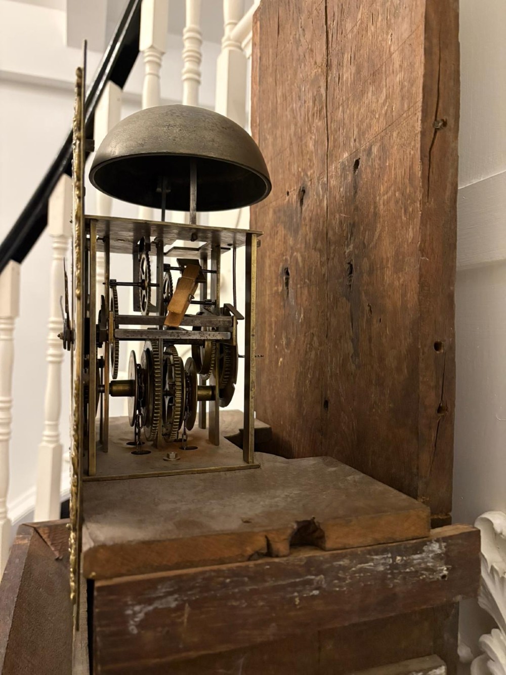 A George III oak and burr oak longcase clock featuring a square brass dial, fretwork hood frieze, and a long waist door. View II