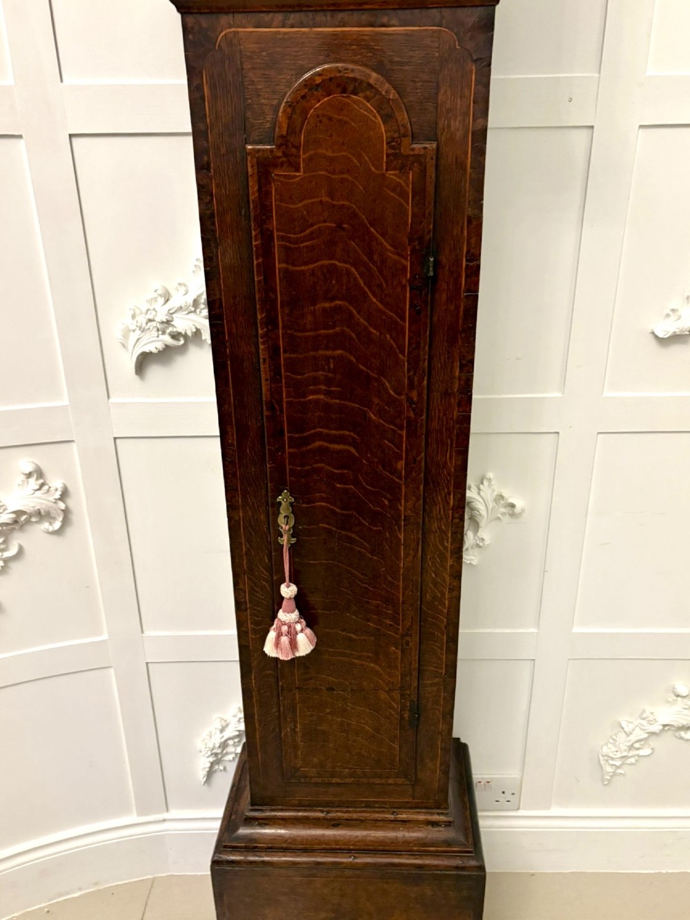 A George III oak and burr oak longcase clock featuring a square brass dial, fretwork hood frieze, and a long waist door. View XIII