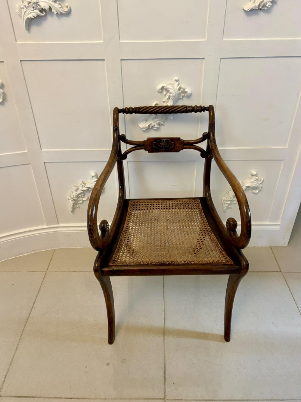 A set of six dark mahogany Regency dining chairs featuring rope-twist top rails, curved sabre legs, and woven cane seats. View II