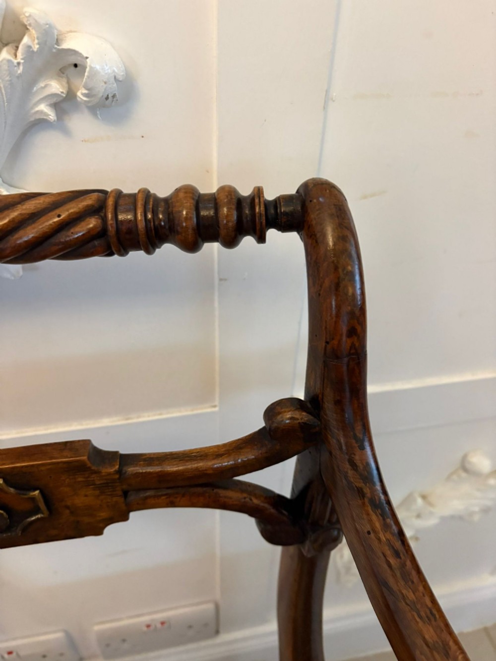 A set of six dark mahogany Regency dining chairs featuring rope-twist top rails, curved sabre legs, and woven cane seats. View III