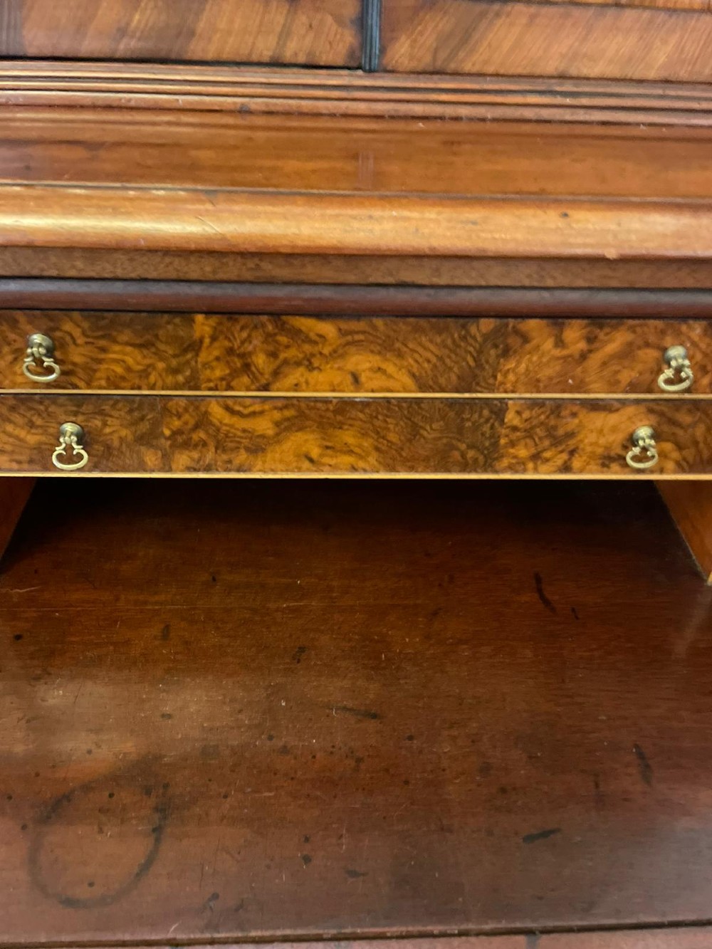 An antique Regency mahogany secretaire bookcase featuring a top scroll pediment, glazed upper doors with astragal moulding, and a lower double cupboard. View III