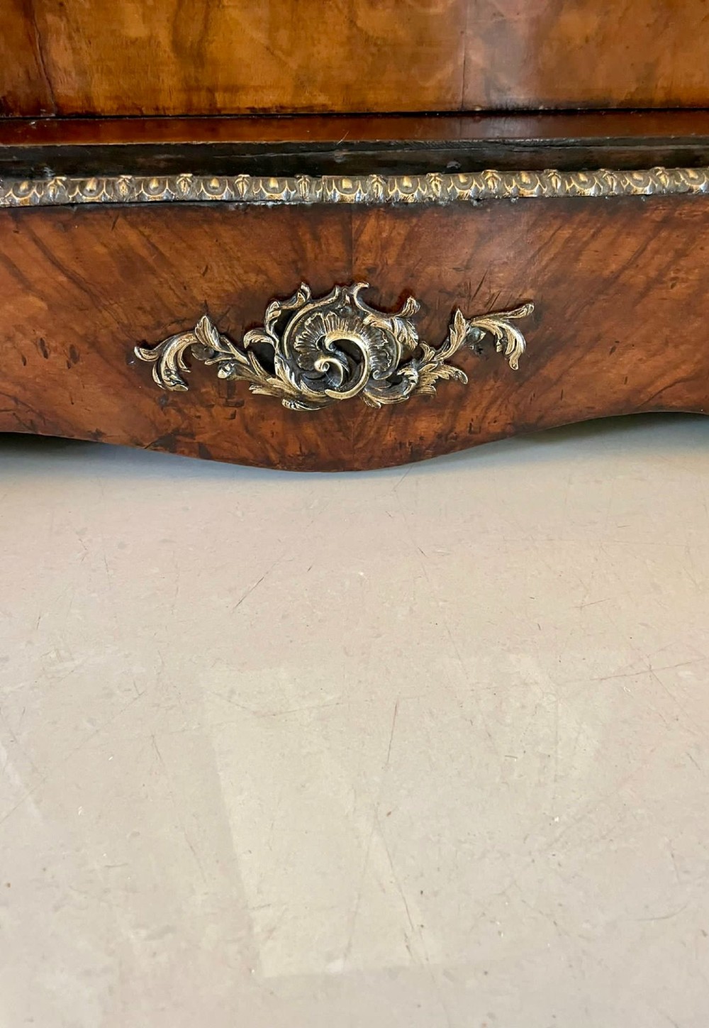 A Victorian burr walnut breakfront credenza featuring brass mounts, a central floral marquetry panel, and mirrored side doors. View IX