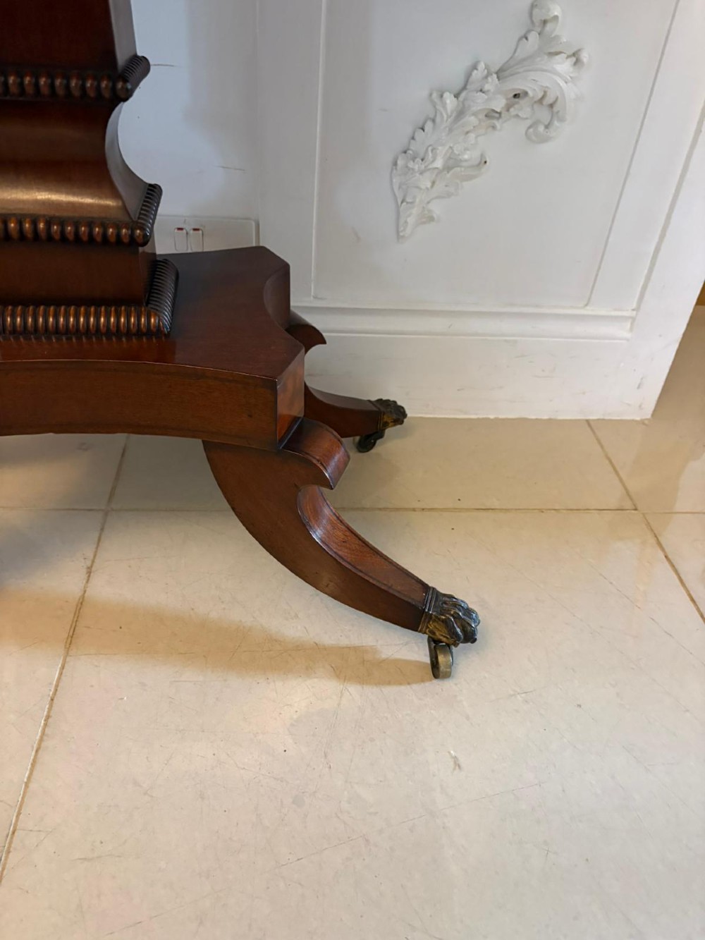 An antique Regency mahogany fold-over card table featuring brass marquetry inlay, a central shaped pedestal, and a splayed base with brass castors. View XI