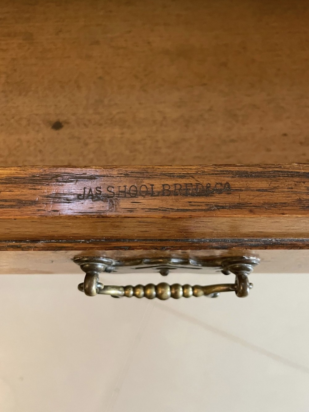 An antique Victorian pollard oak mirror-back sideboard featuring carved field panels, spindled galleries, and multiple mirrored sections. View IV