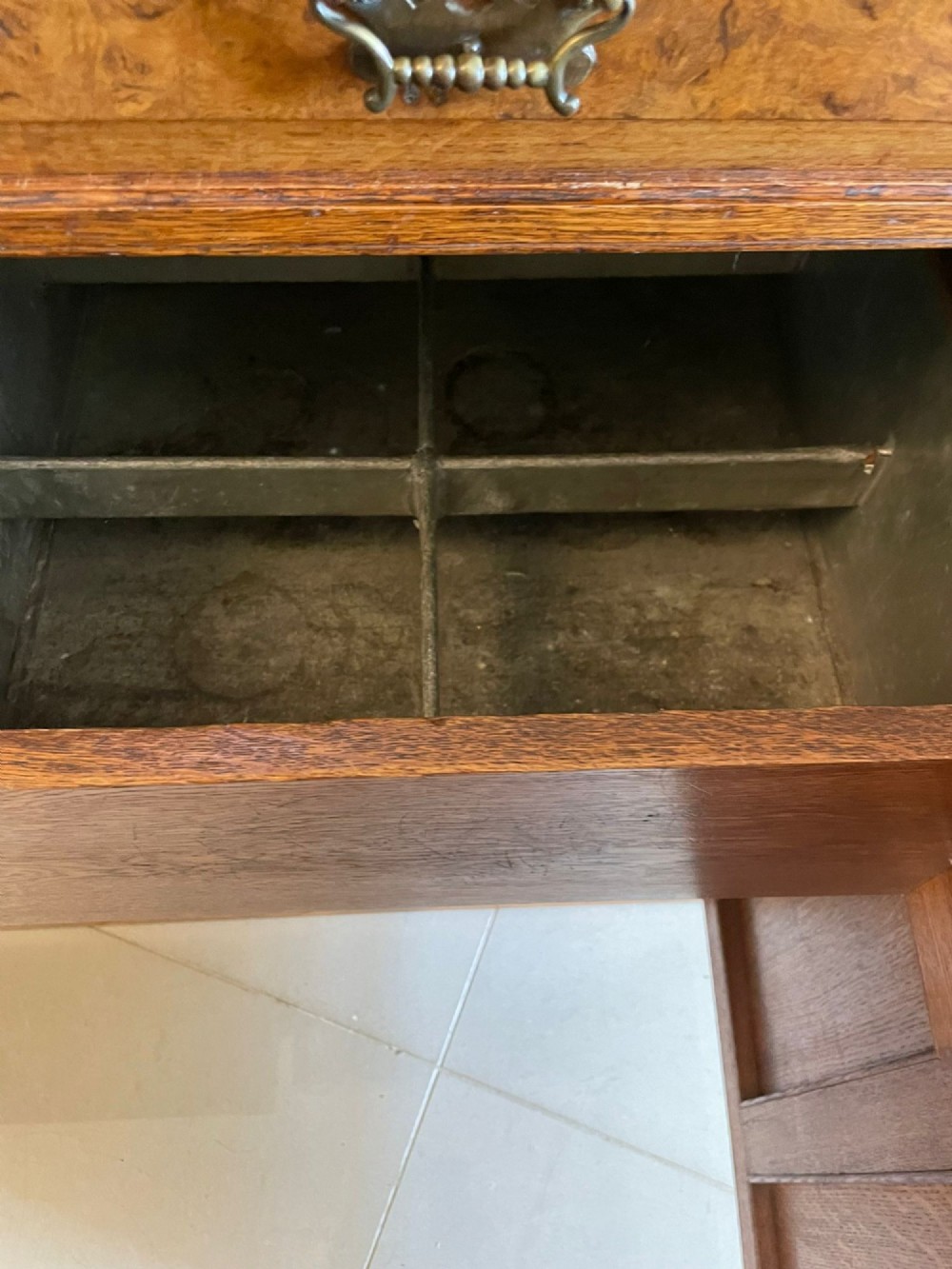 An antique Victorian pollard oak mirror-back sideboard featuring carved field panels, spindled galleries, and multiple mirrored sections. View V