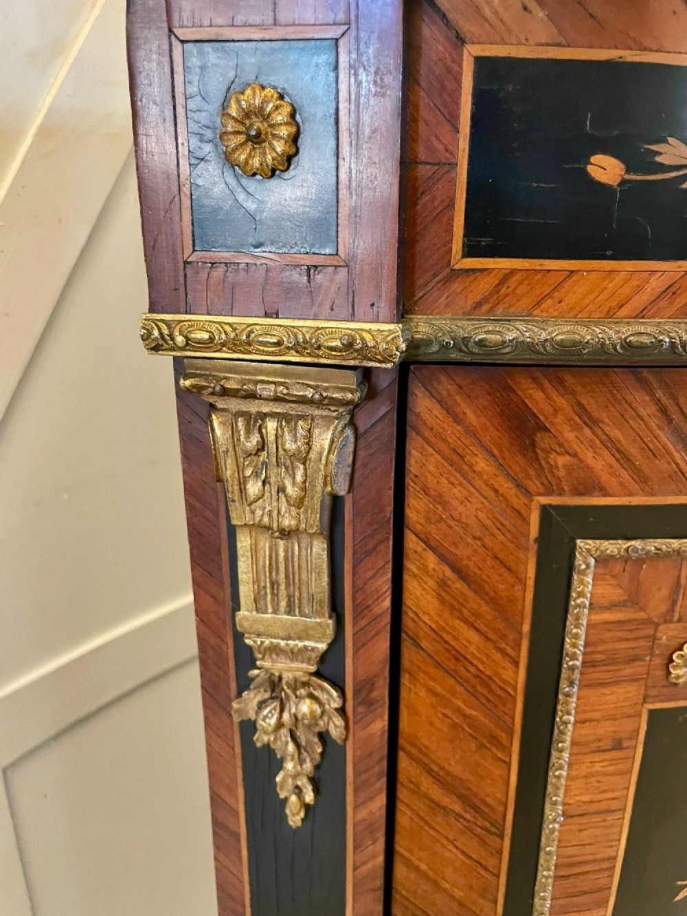 A French Louis XVI style corner cabinet featuring a bow-front door with floral wood marquetry inlay, gilt bronze mounts, and a fitted white marble top. View II