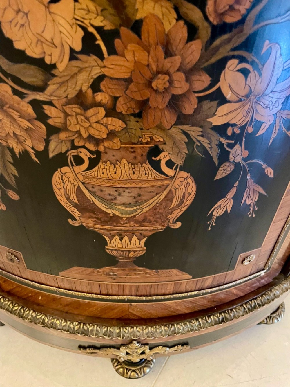 A French Louis XVI style corner cabinet featuring a bow-front door with floral wood marquetry inlay, gilt bronze mounts, and a fitted white marble top. View IV