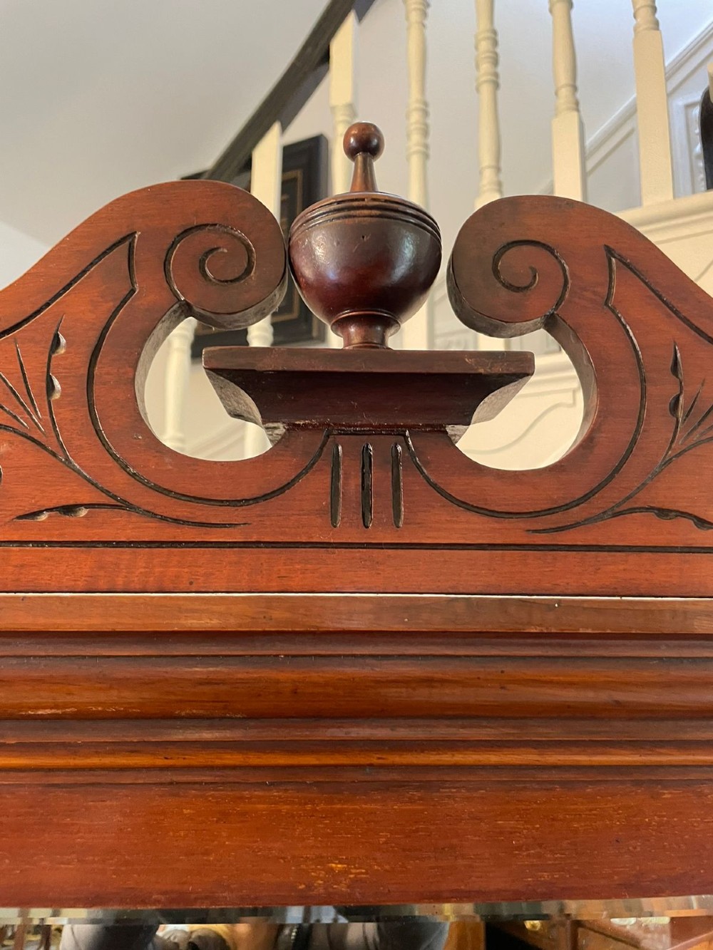 A carved walnut Victorian mirror-back sideboard featuring turned columns, carved fan panels, multiple mirrors, and brass drawer handles. View V