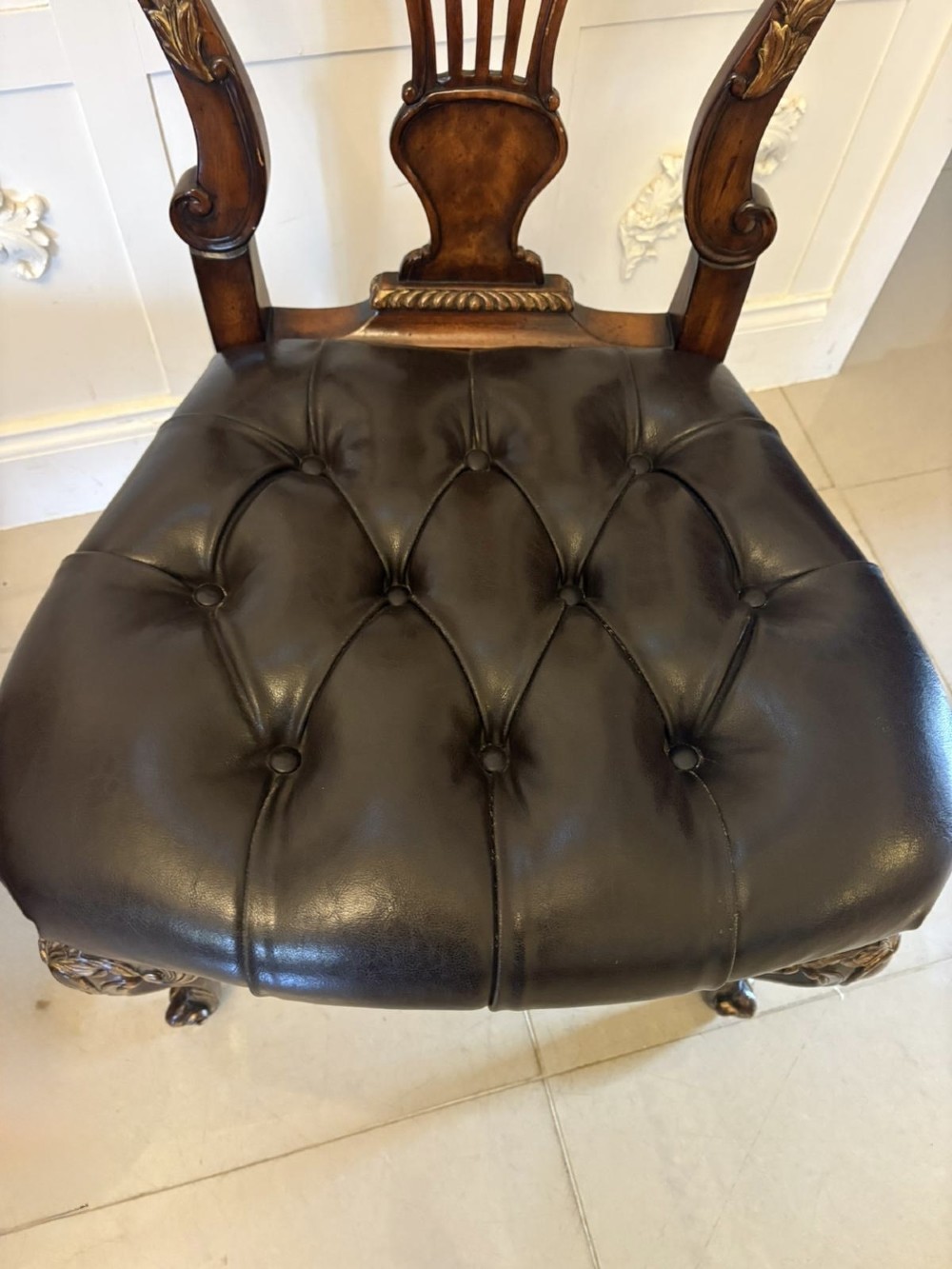 Set of eight Edwardian carved walnut dining chairs featuring pierced backrests, gilded highlights, cabriole legs, and dark brown button-tufted leather seats. View XI