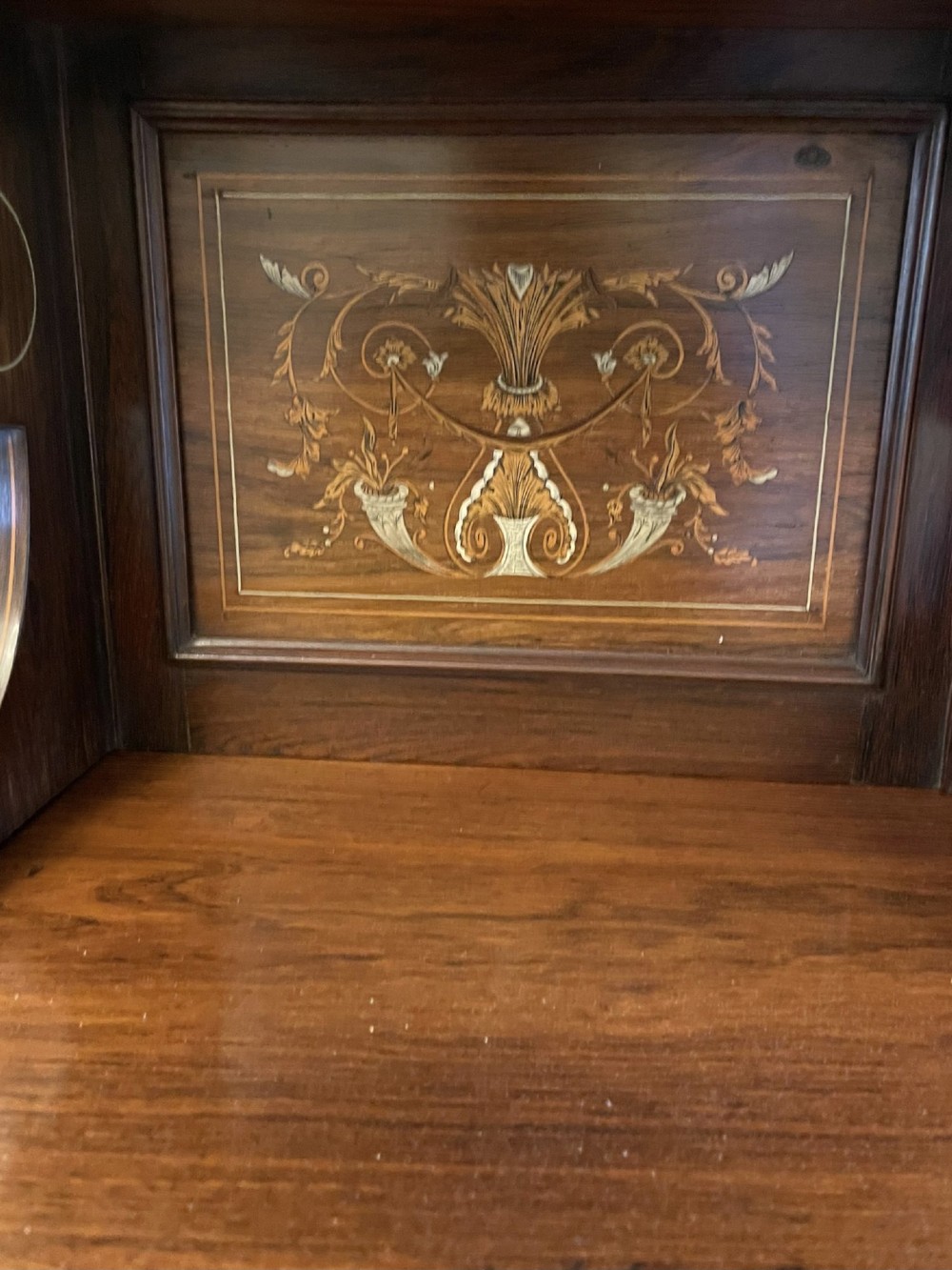An antique Victorian dark rosewood side cabinet featuring intricate floral inlay, multiple bevelled mirror sections, open shelving, and a central cupboard door. View X