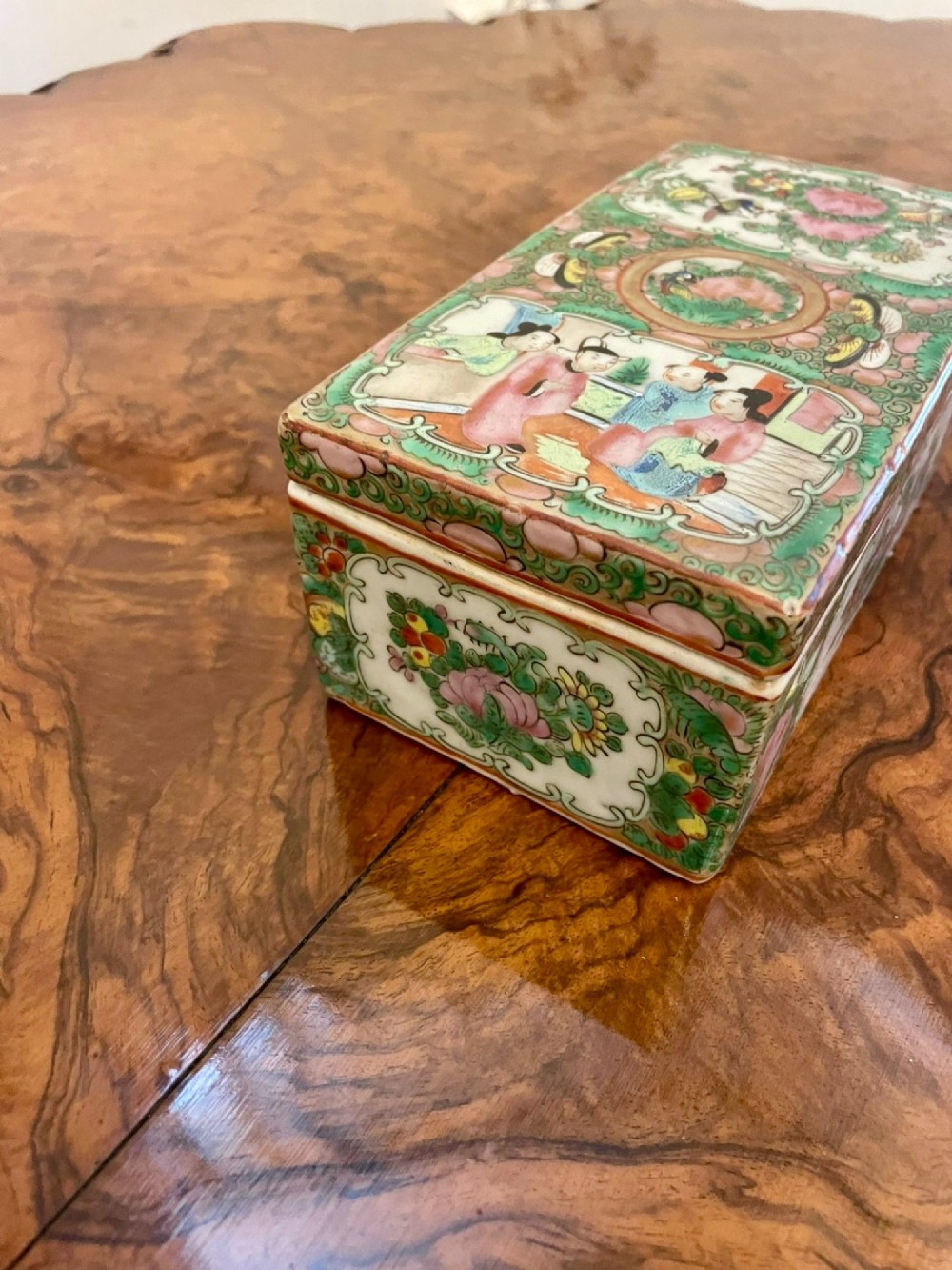 A rectangular 19th-century Chinese Canton Famille Rose porcelain box with lid decorated with hand-painted figure panels, pink flowers, and green scroll motifs. View XIII