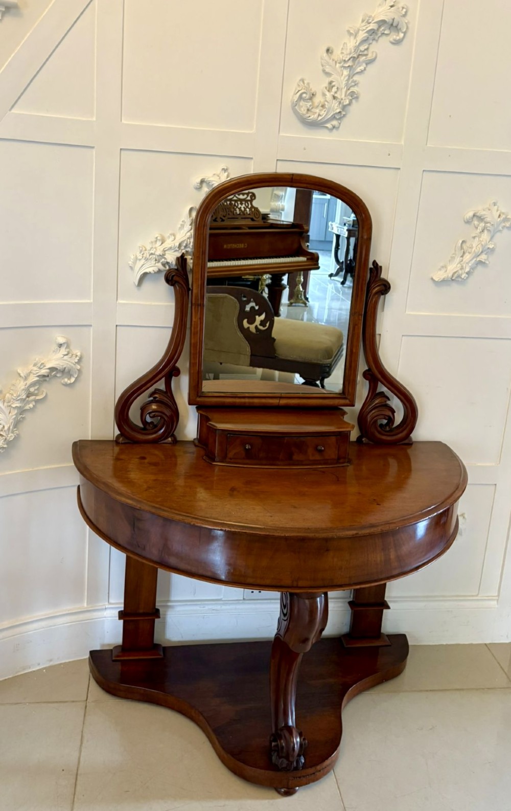 An antique Victorian mahogany dressing table featuring an arched swing mirror with scroll supports above a curved tabletop and shaped platform base. View VIII