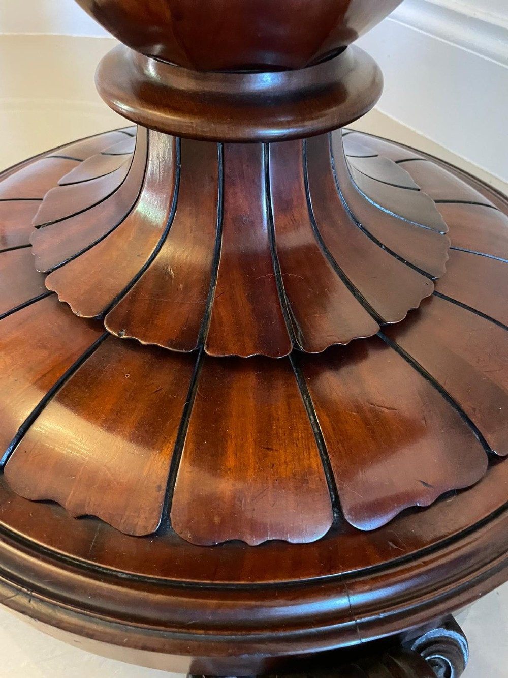 A Victorian mahogany fold-over card table featuring a rectangular top, carved apron, turned central pedestal, and four scroll feet. View IV