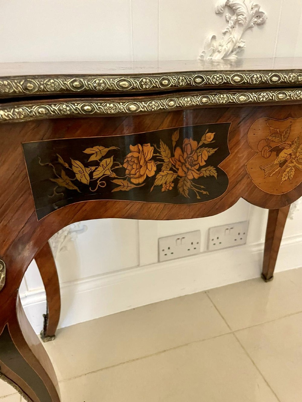 A French Rococo style kingwood card table featuring floral marquetry inlays, gilt-bronze ormolu mounts, and curved cabriole legs. View IV