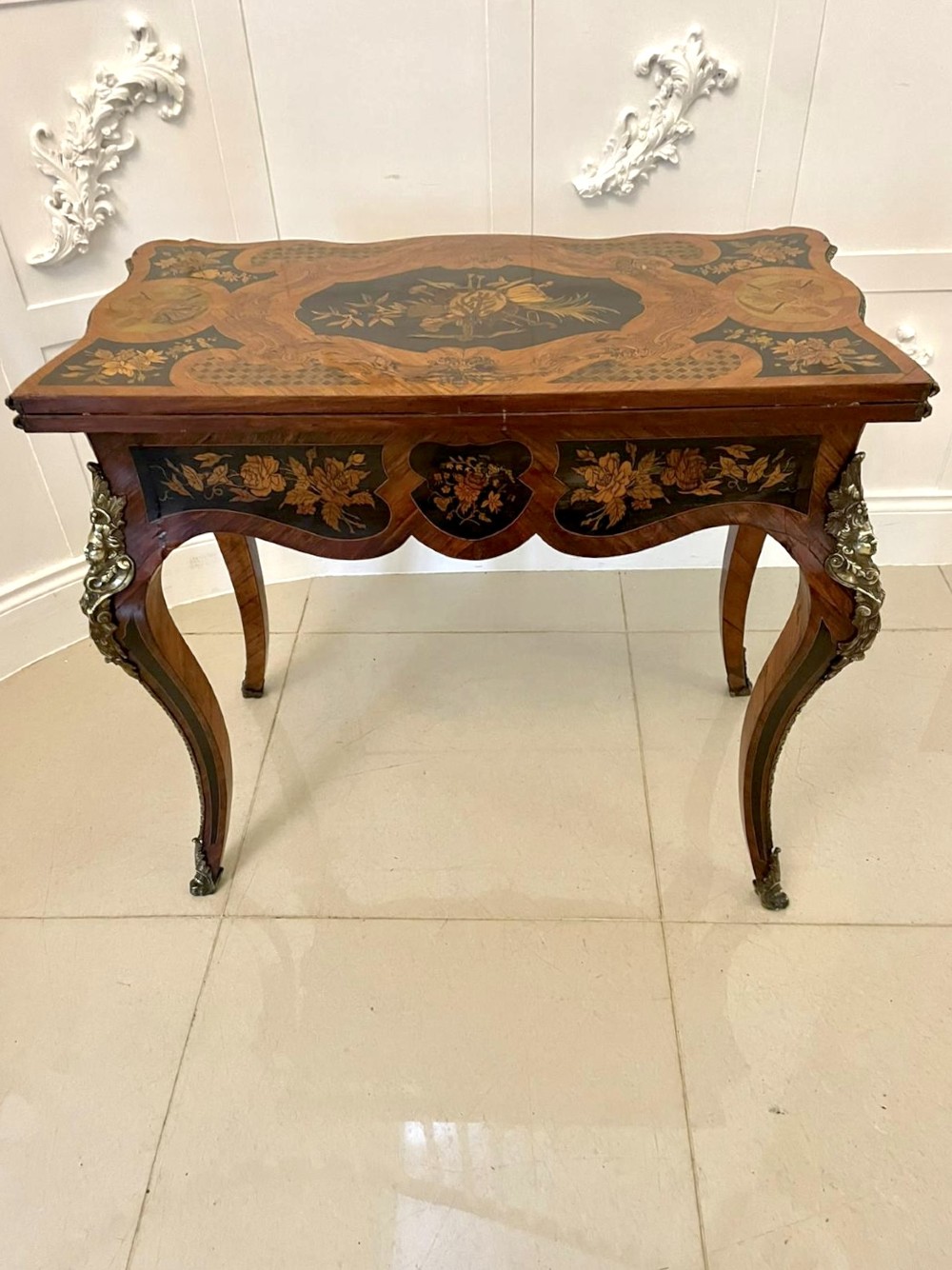 A French Rococo style kingwood card table featuring floral marquetry inlays, gilt-bronze ormolu mounts, and curved cabriole legs. View VII