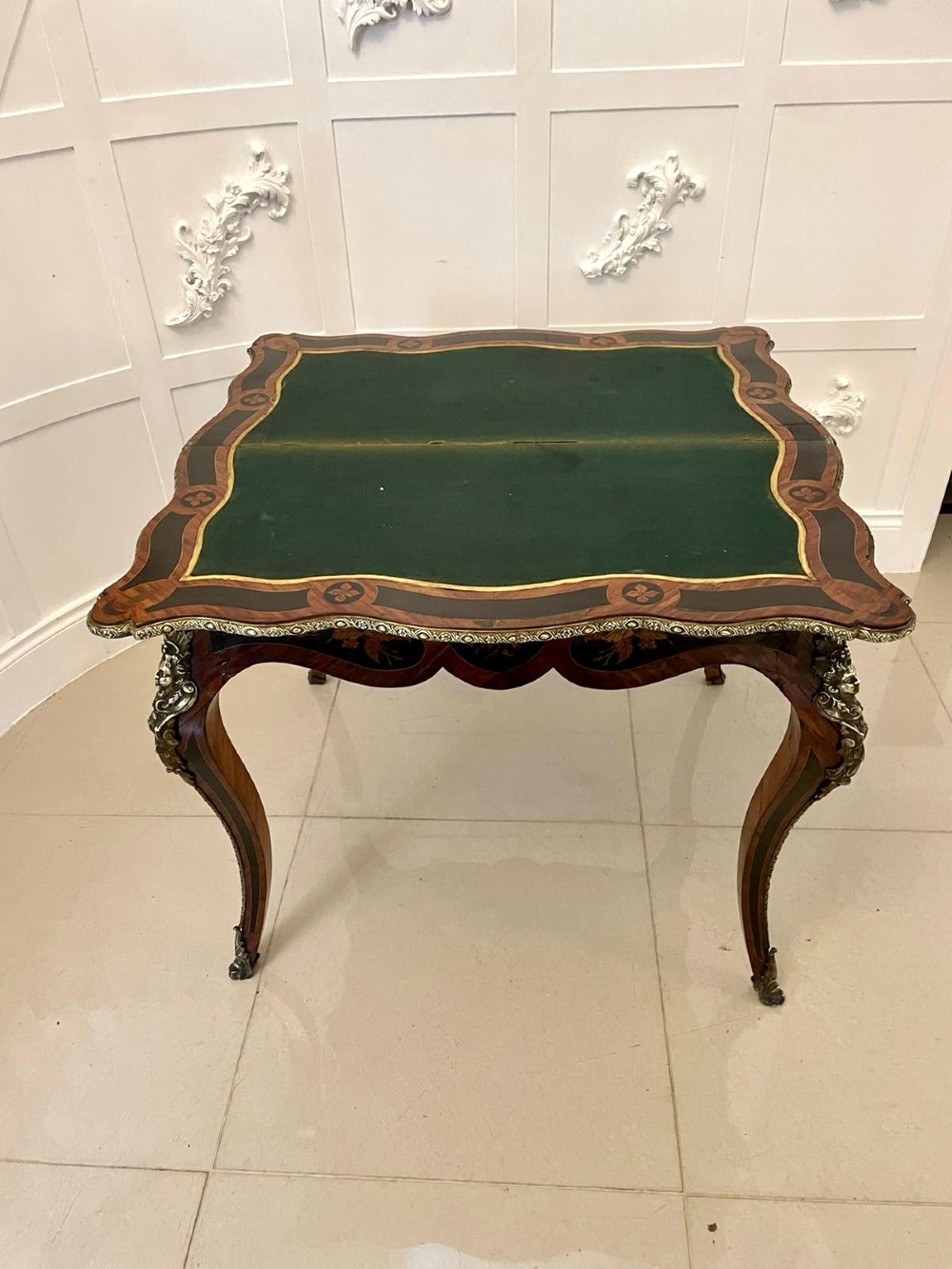 A French Rococo style kingwood card table featuring floral marquetry inlays, gilt-bronze ormolu mounts, and curved cabriole legs. View VIII
