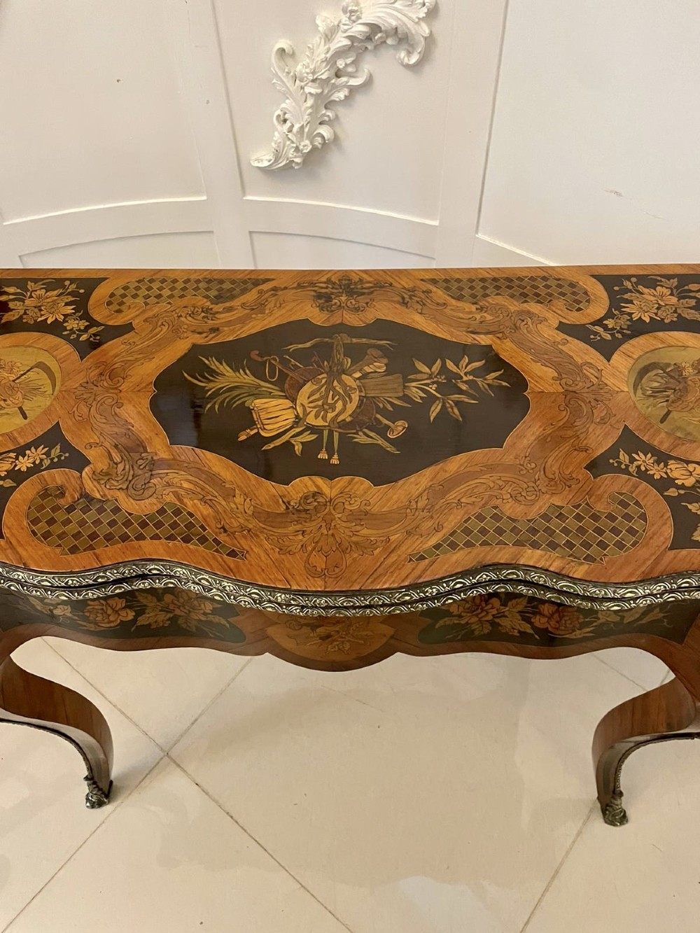 A French Rococo style kingwood card table featuring floral marquetry inlays, gilt-bronze ormolu mounts, and curved cabriole legs. View XIII