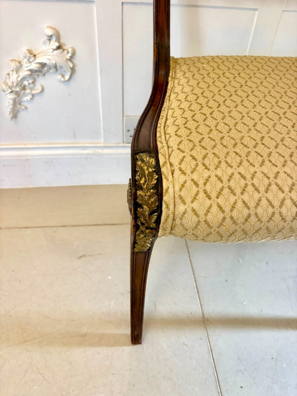 A set of eight antique Regency mahogany dining chairs featuring patterned gold upholstery, carved scrolling mid-rails, and brass detailing. View XIII