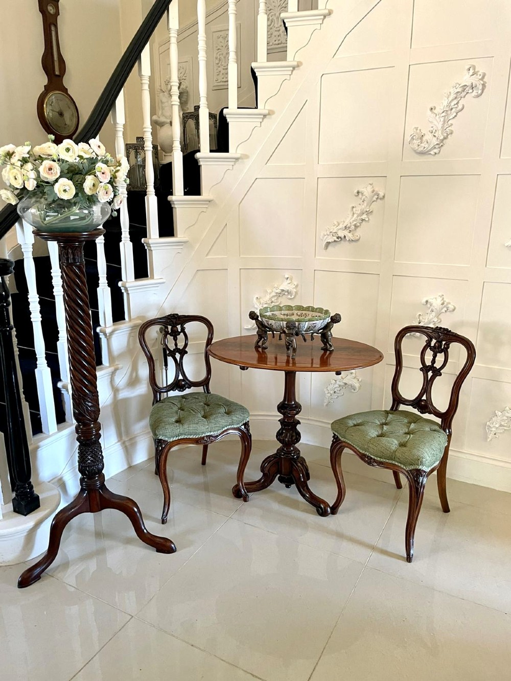 A set of four Victorian French carved walnut side chairs featuring openwork backrests and button-upholstered sage green fabric seats on cabriole legs. View II