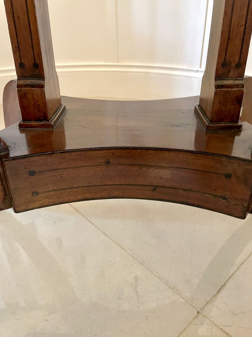 A Regency mahogany fold-over card table featuring an inlaid apron, central pedestal support, and four sabre legs with brass lion paw feet and castors. View VIII