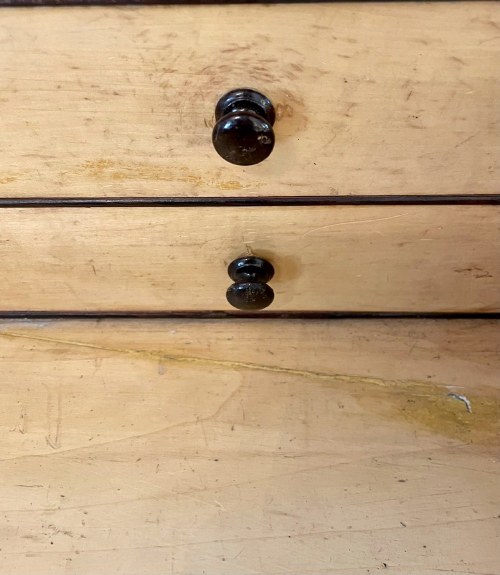 A Victorian rosewood Davenport desk featuring a sloped dark green leather writing surface, decorative brass gallery rail, carved cabriole front supports, and side drawers. View XII