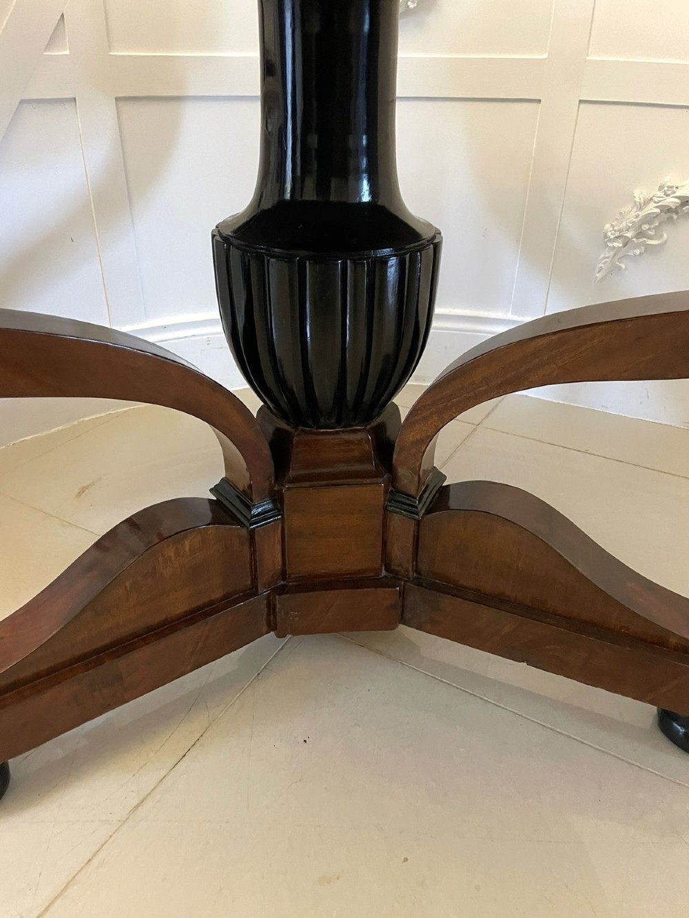 A circular antique French centre table featuring a polished red-and-white variegated marble top on a mahogany apron with curved legs and carved paw feet. View V