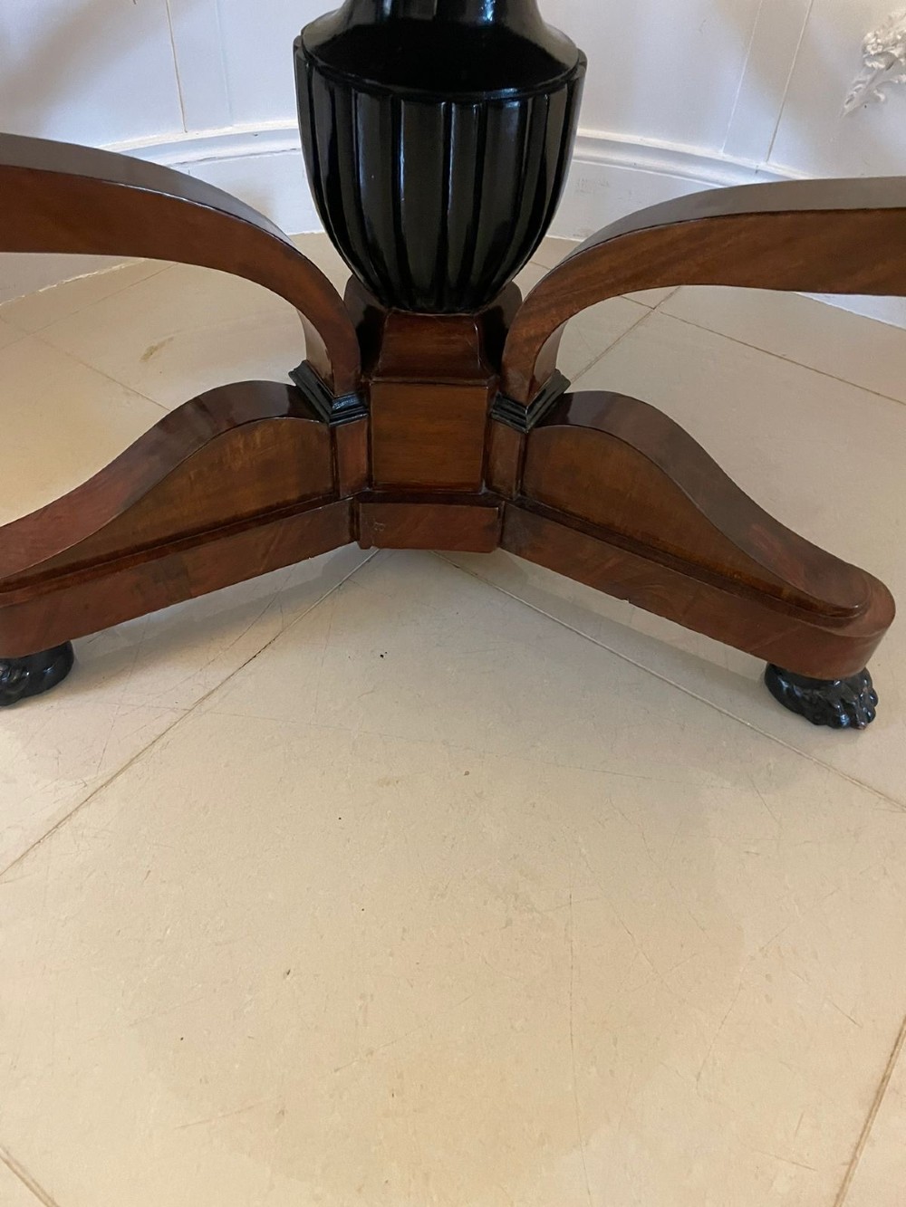 A circular antique French centre table featuring a polished red-and-white variegated marble top on a mahogany apron with curved legs and carved paw feet. View X