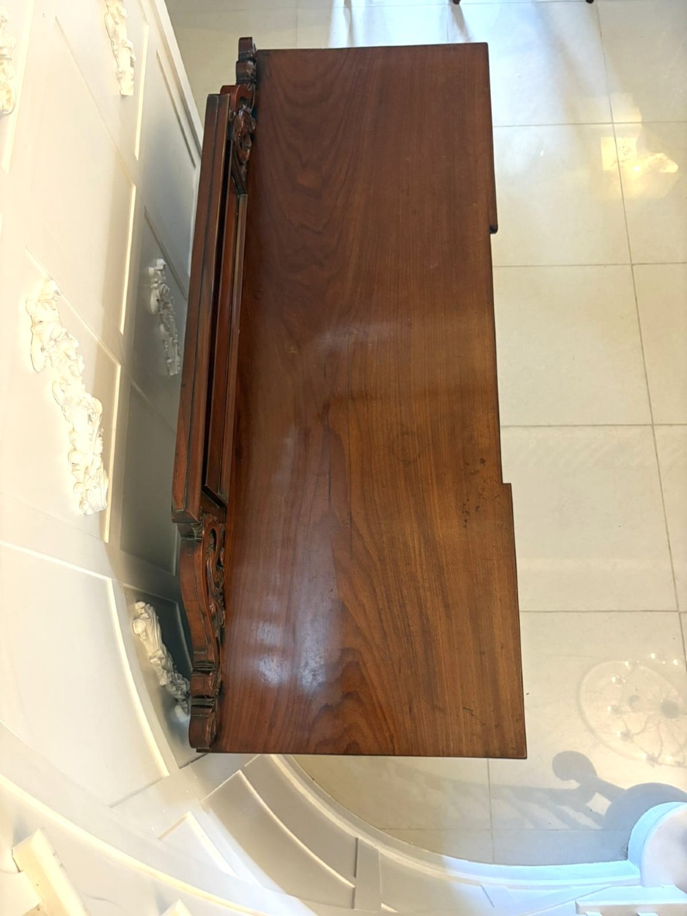 A Victorian mahogany pedestal sideboard featuring a raised backboard with carved scrollwork and two flanking pedestal cupboards. View VII