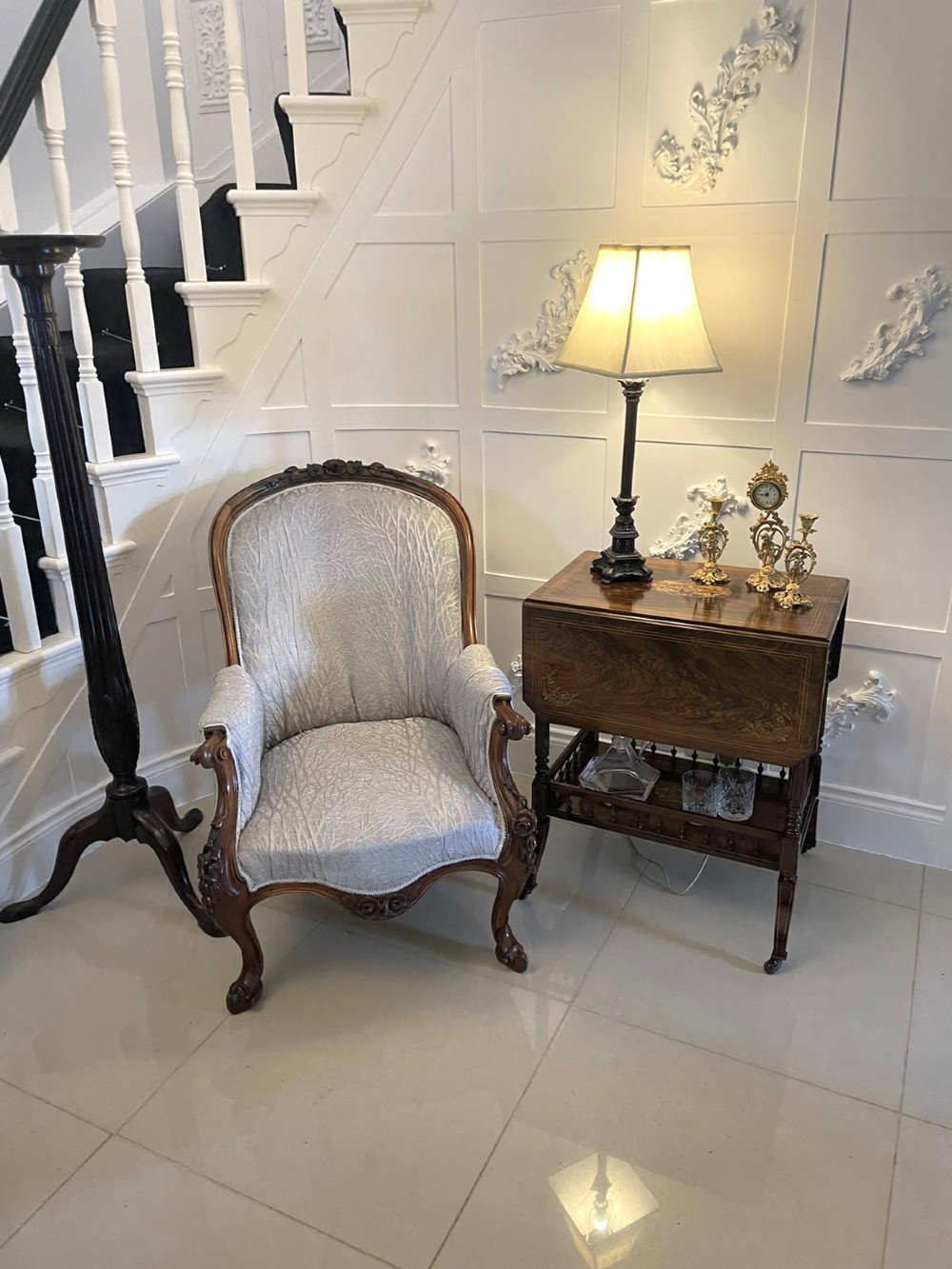 A Victorian rosewood drop-leaf centre table featuring floral marquetry inlay, turned legs on brass castors, and a lower tiered shelf with a spindle gallery. View IV