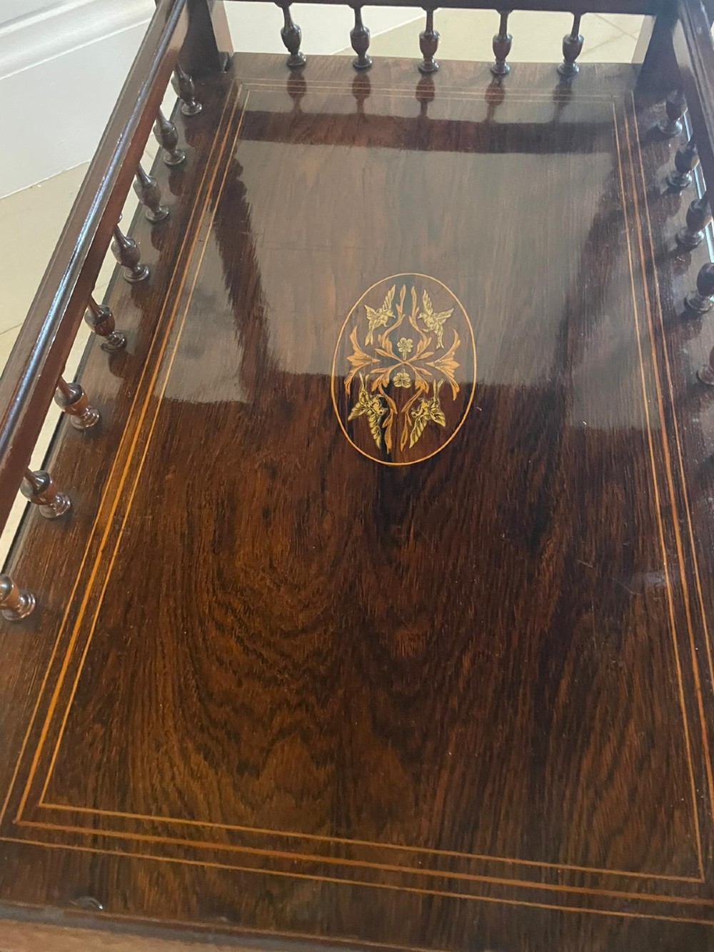 A Victorian rosewood drop-leaf centre table featuring floral marquetry inlay, turned legs on brass castors, and a lower tiered shelf with a spindle gallery. View XIII