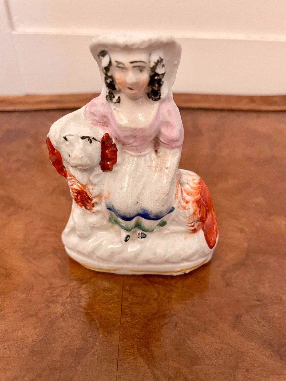 A collection of six antique Victorian earthenware Staffordshire dog figures with hand-painted rust red, black, and polychrome detailing. View XII