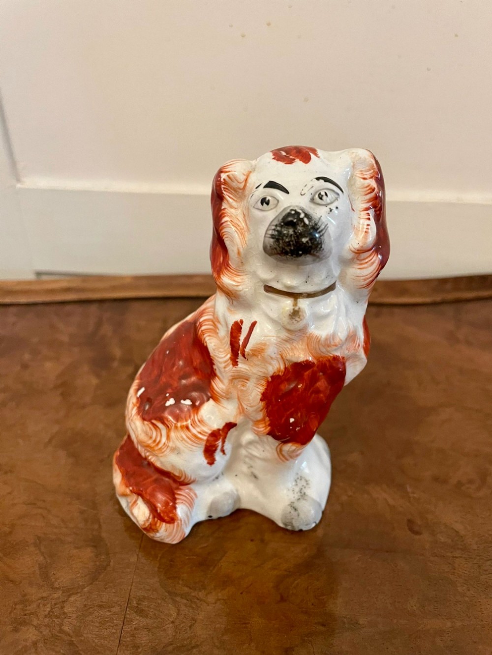 A collection of six antique Victorian earthenware Staffordshire dog figures with hand-painted rust red, black, and polychrome detailing. View XIII