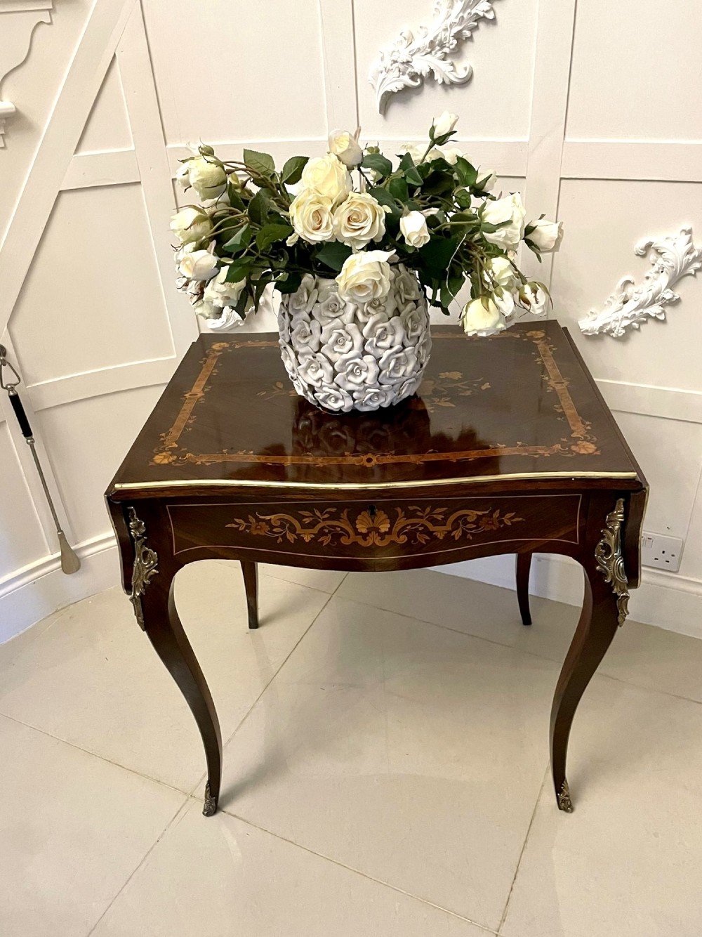 A French Louis XV style rosewood centre table featuring floral marquetry inlay, sweeping cabriole legs, and ornate gilt bronze mounts. View III