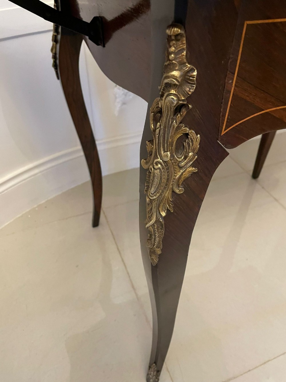 A French Louis XV style rosewood centre table featuring floral marquetry inlay, sweeping cabriole legs, and ornate gilt bronze mounts. View XIII