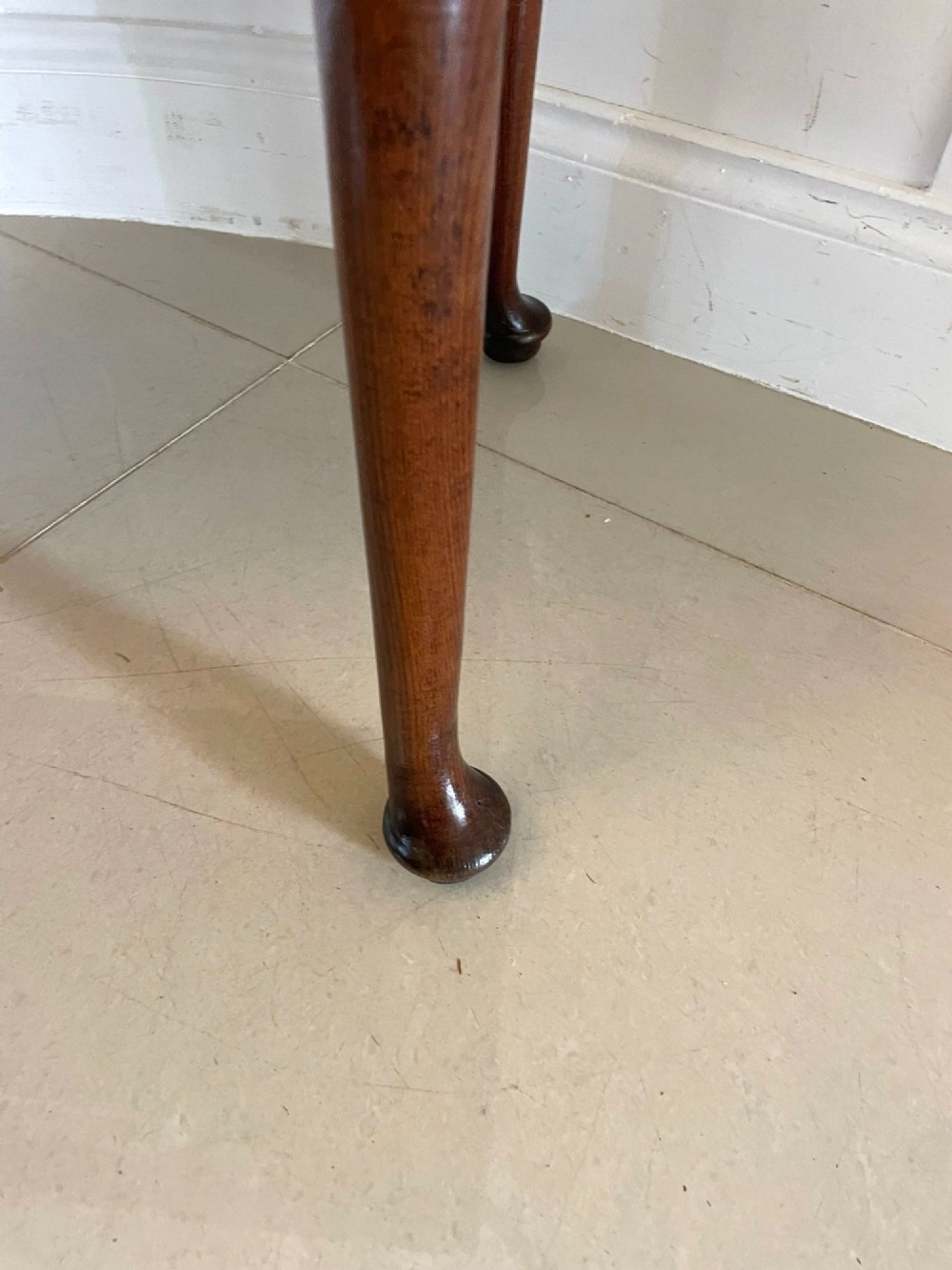 A George III oak lowboy table with three drawers, brass handles, a shaped apron, and cabriole legs with pad feet. View III