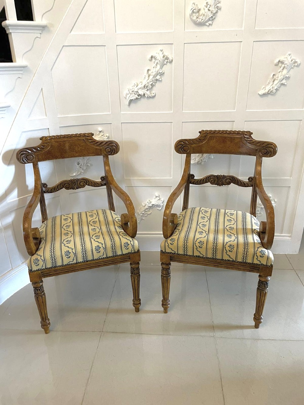 A set of eight antique Regency style dining chairs featuring decorative faux birds eye maple painted finishes and striped fabric seats. View VII