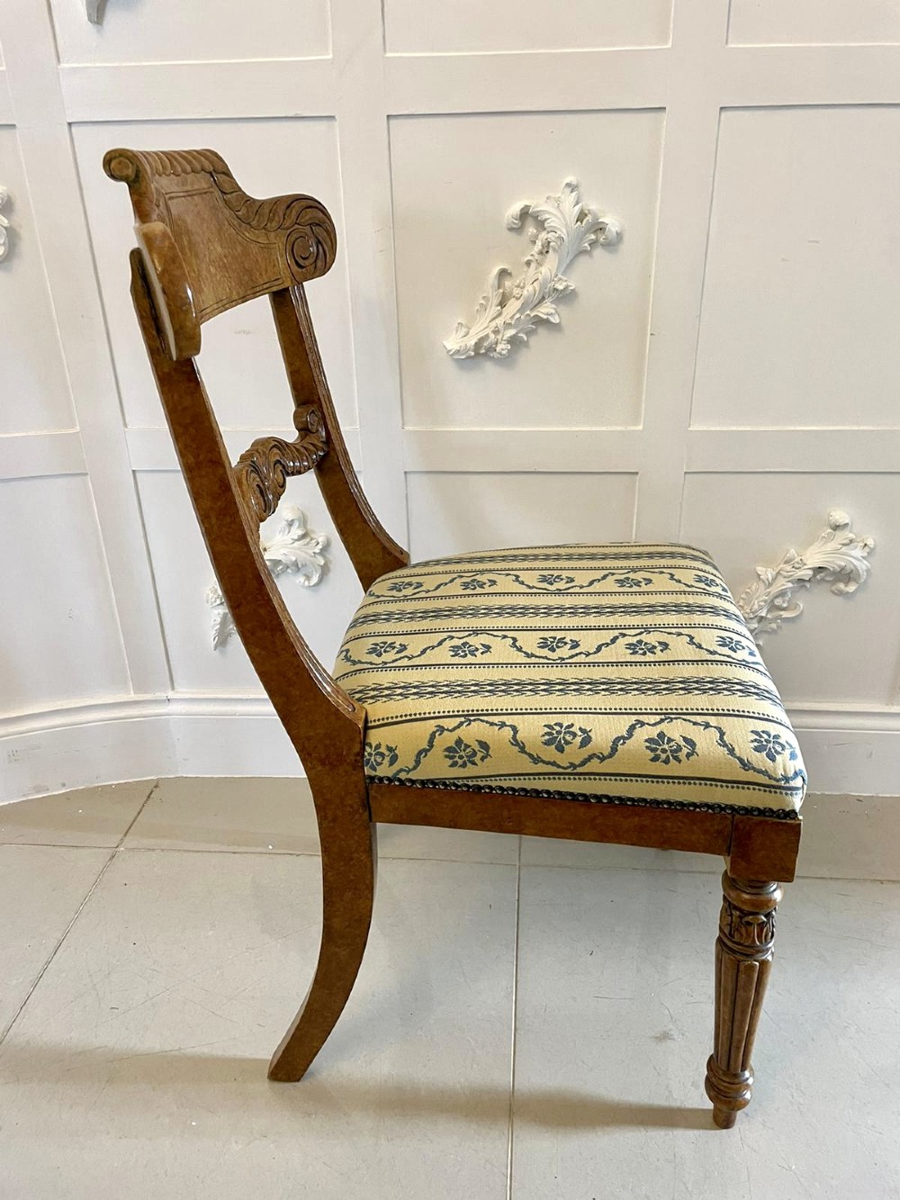 A set of eight antique Regency style dining chairs featuring decorative faux birds eye maple painted finishes and striped fabric seats. View XI