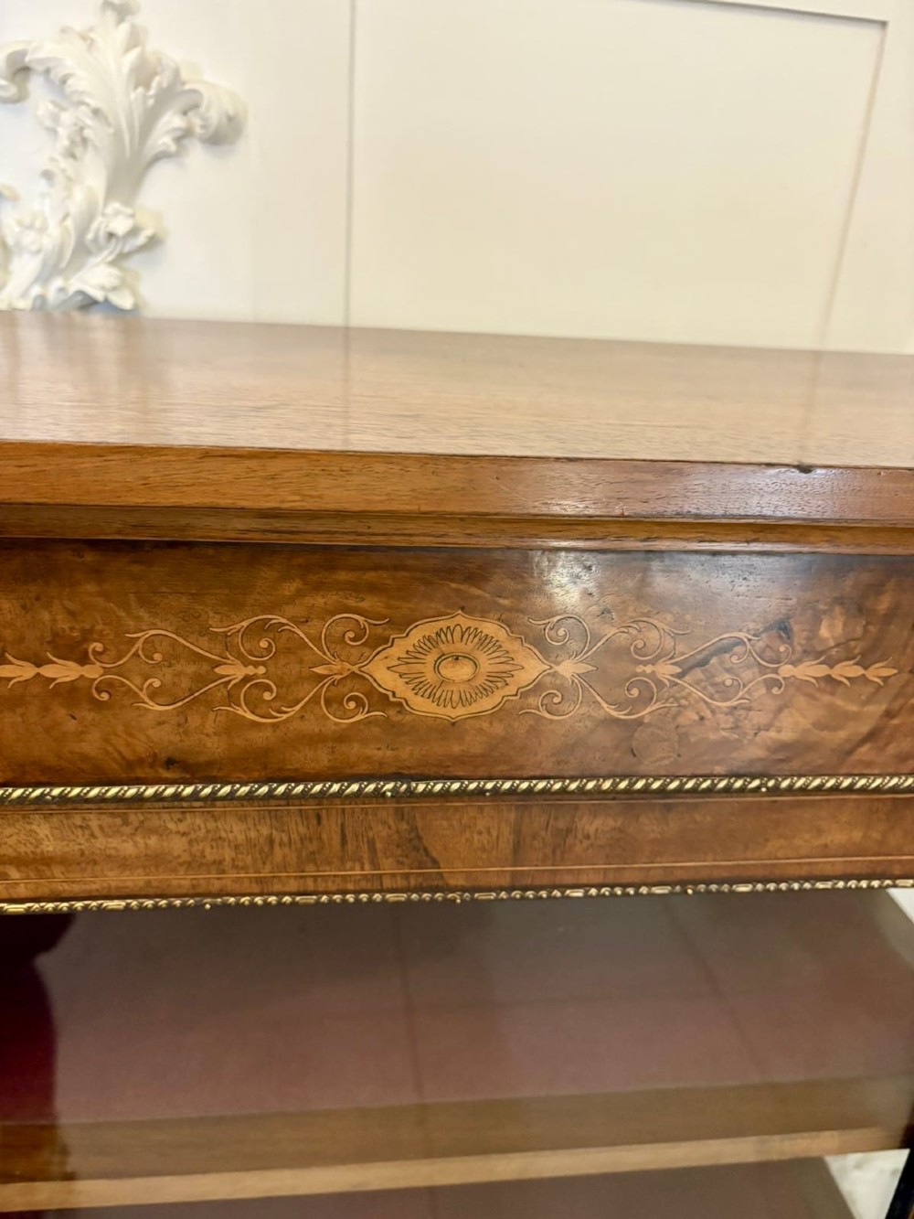 A Victorian burr walnut pier cabinet featuring a single glazed door, floral marquetry along the frieze, and gilt ormolu corner mounts. View VIII