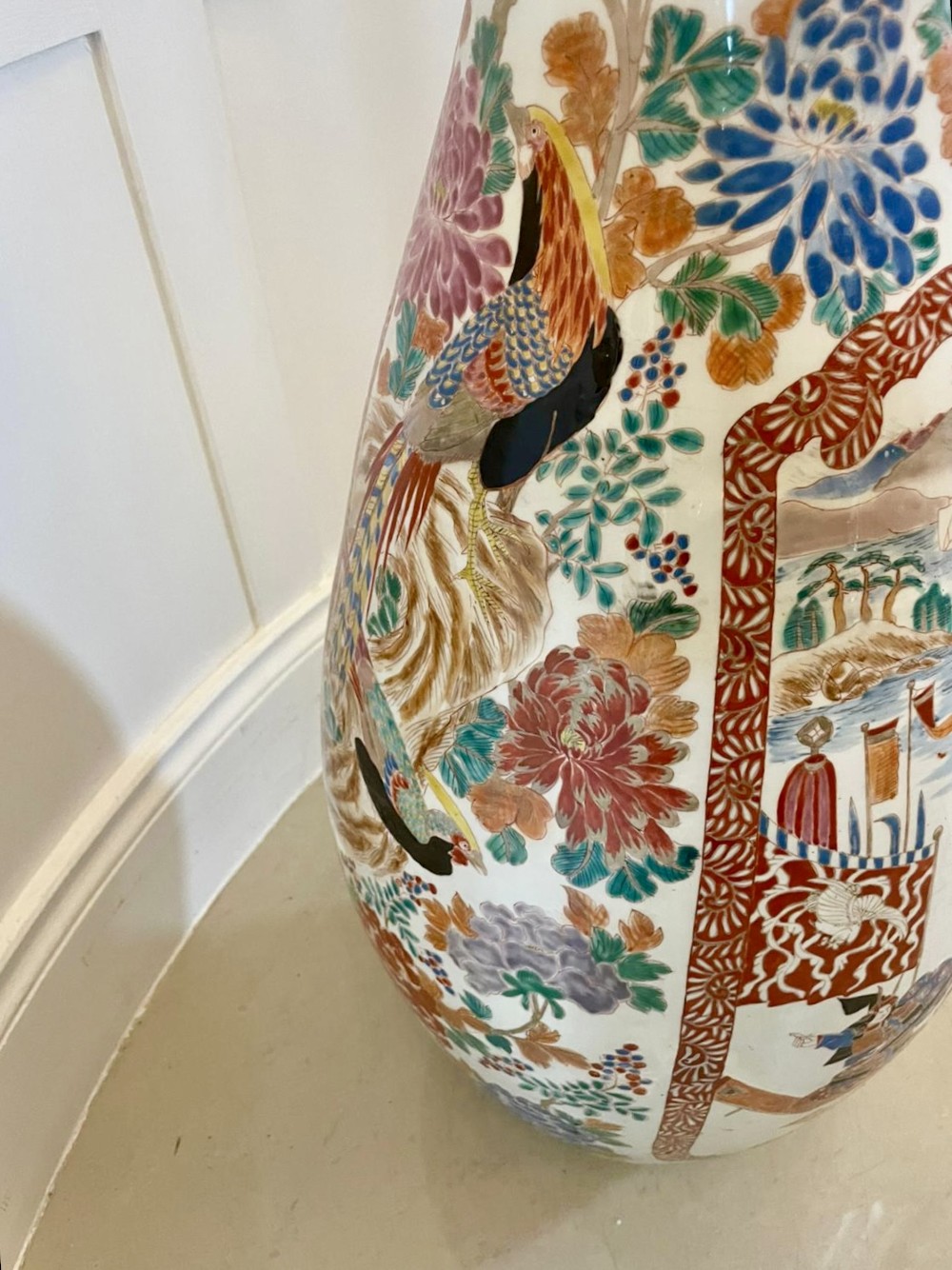 A tall 19th-century Japanese Imari porcelain floor-standing vase featuring polychrome enamel figurative scenes, floral motifs, and a fluted frilled rim. View IV
