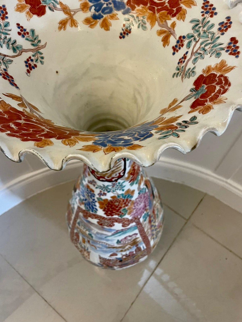 A tall 19th-century Japanese Imari porcelain floor-standing vase featuring polychrome enamel figurative scenes, floral motifs, and a fluted frilled rim. View V