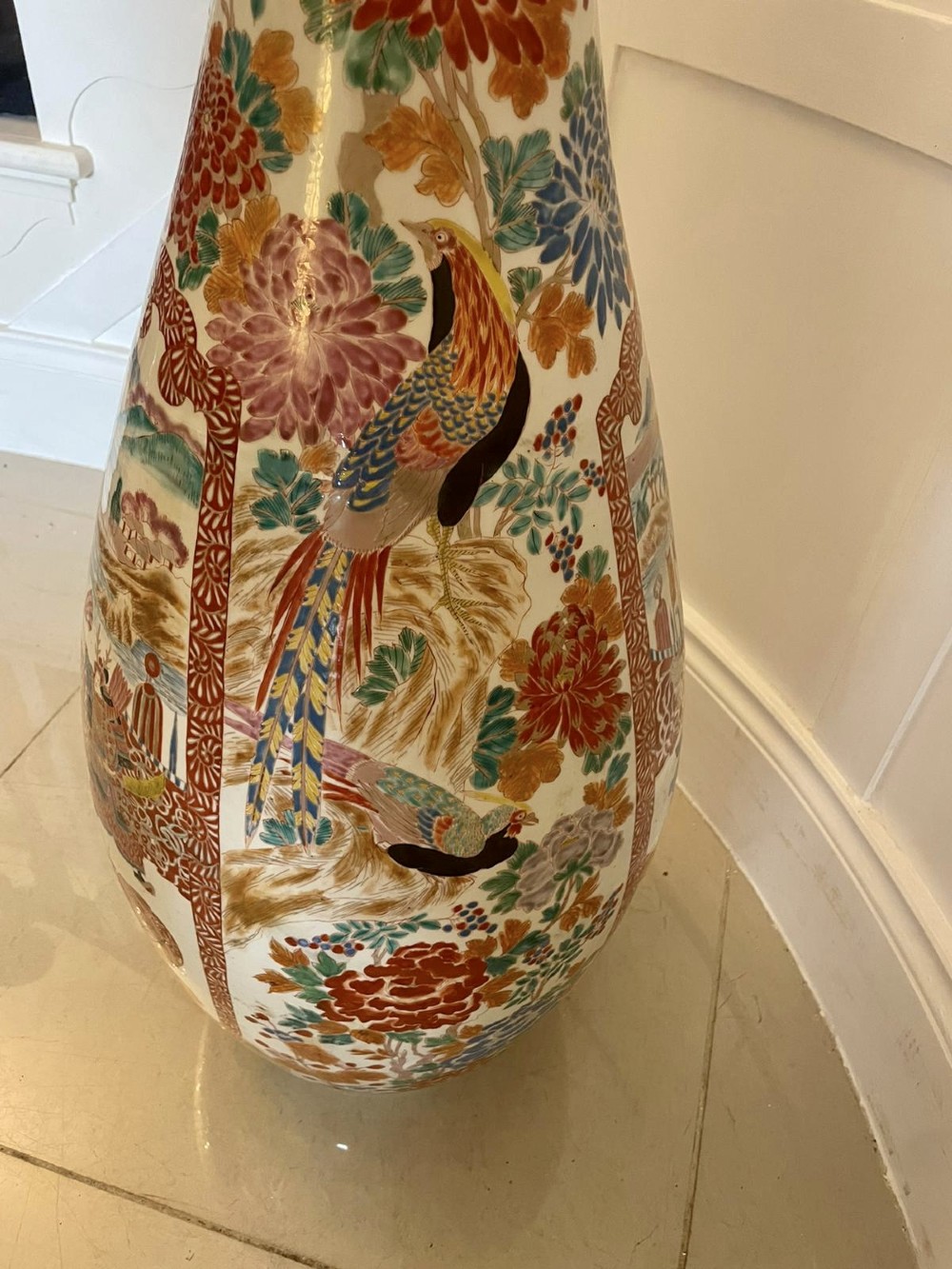 A tall 19th-century Japanese Imari porcelain floor-standing vase featuring polychrome enamel figurative scenes, floral motifs, and a fluted frilled rim. View VI
