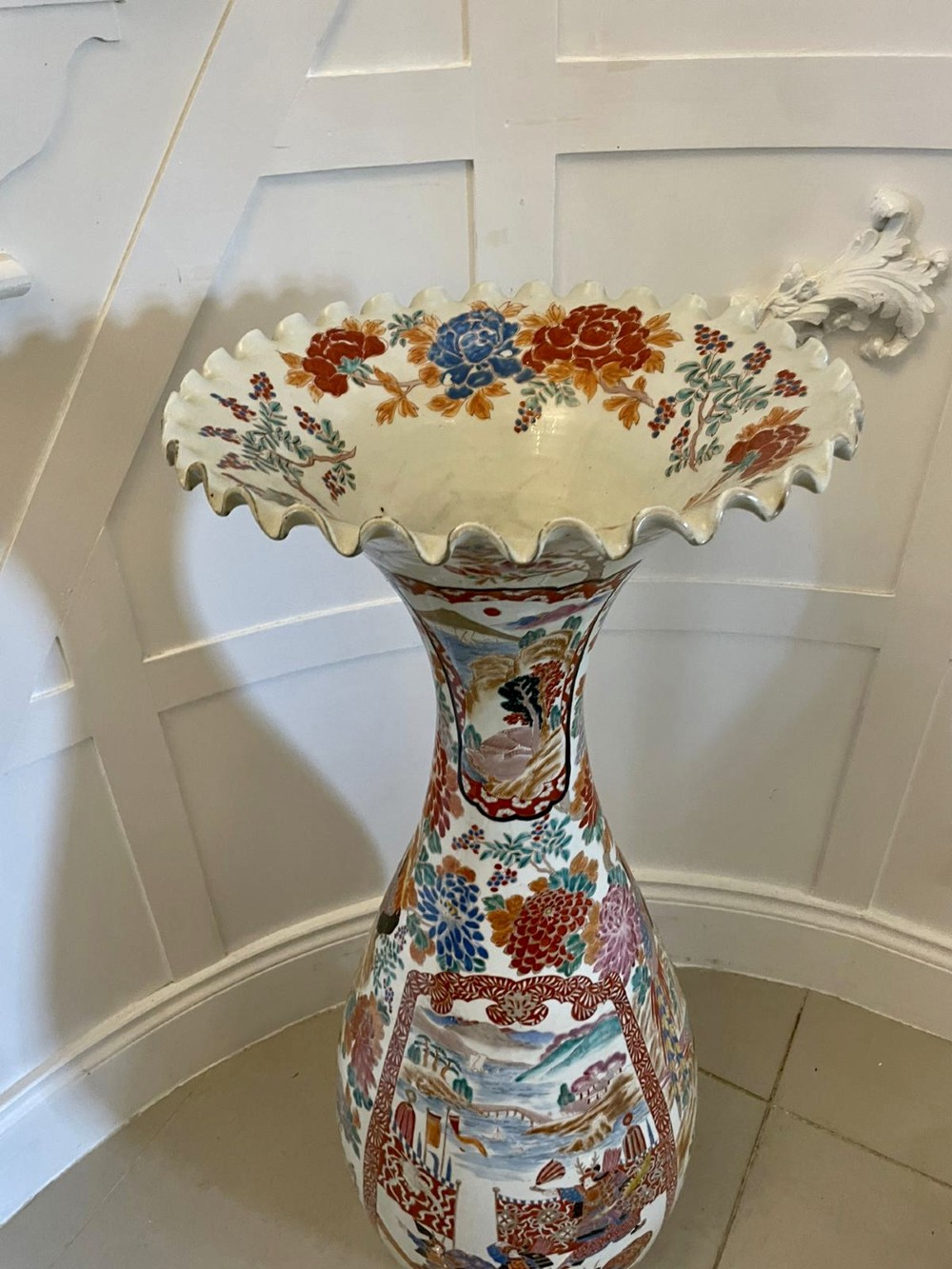 A tall 19th-century Japanese Imari porcelain floor-standing vase featuring polychrome enamel figurative scenes, floral motifs, and a fluted frilled rim. View XII