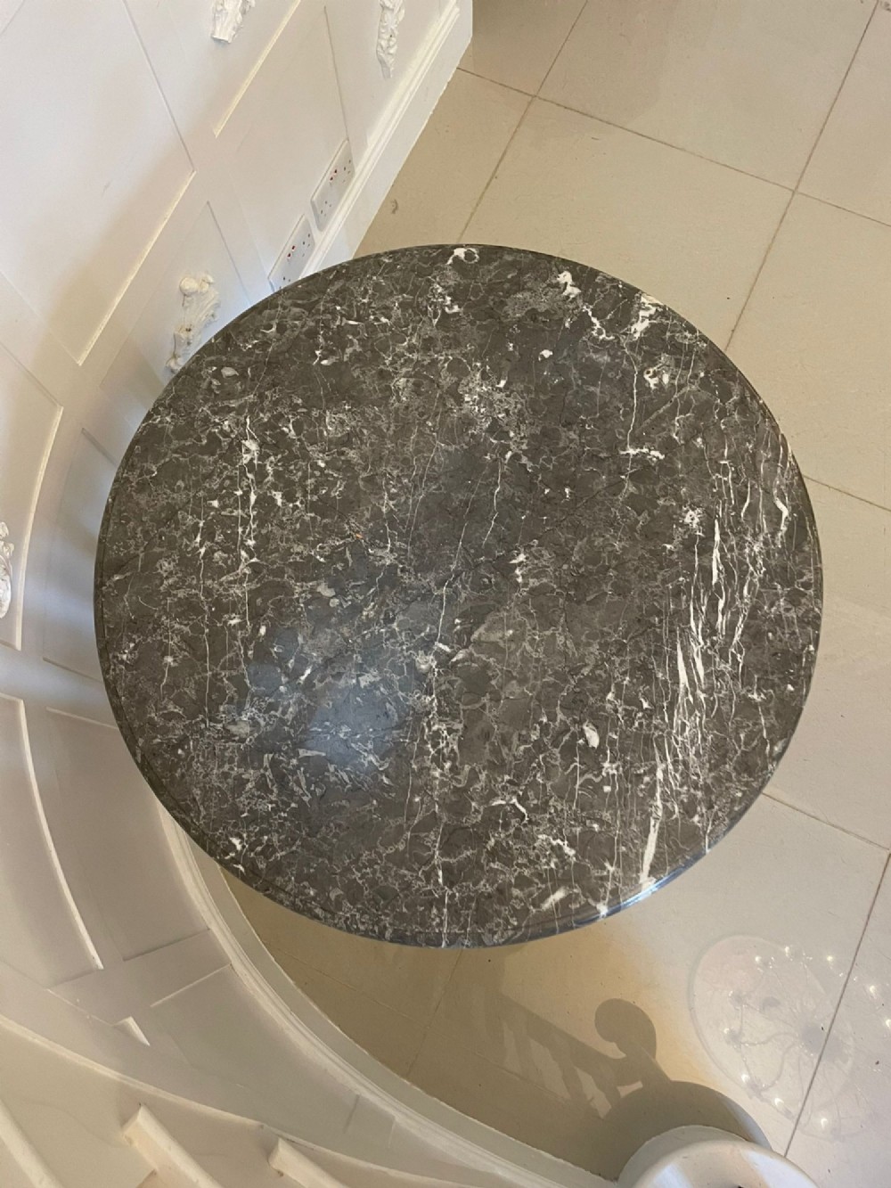 A circular French centre table with a grey marble top, kingwood veneered apron, metal mount, and curved cabriole legs. View II