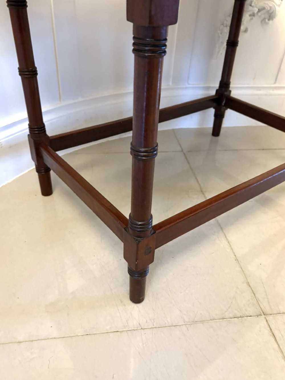 A dark mahogany tray-top occasional table featuring a raised gallery with carved carrying handles, turned legs, and stretchers. View V
