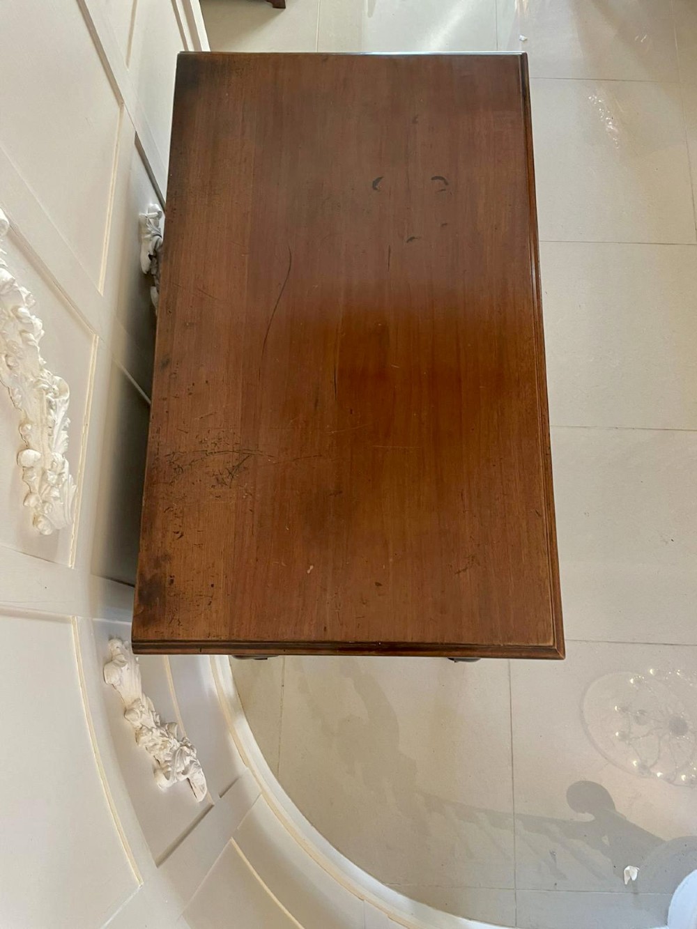 A George III mahogany chest on stand featuring two short over two long drawers, brass handles, a carved shell apron, and cabriole legs. View IX