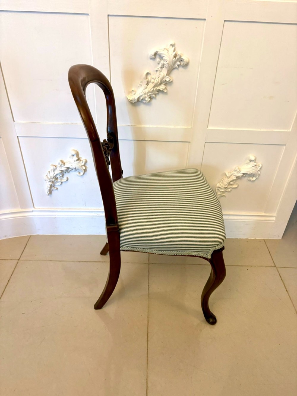 Set of six antique Victorian mahogany dining chairs featuring carved balloon backrests, cabriole front legs, and green-and-white striped fabric seats. View IV