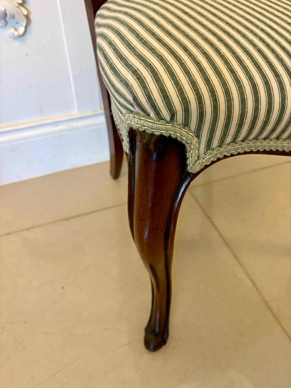 Set of six antique Victorian mahogany dining chairs featuring carved balloon backrests, cabriole front legs, and green-and-white striped fabric seats. View V